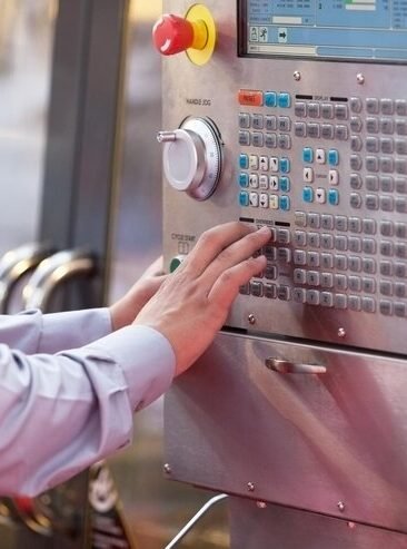 midsection-man-using-machinery_1048944-18490107